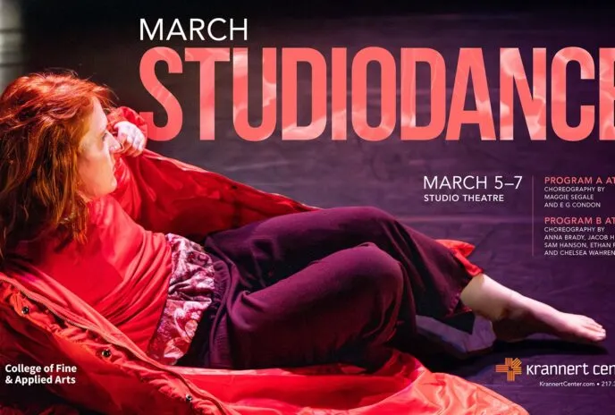 dancer lies on floor with red coat