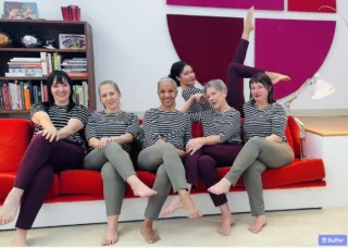 rendering of six people sitting on a couch