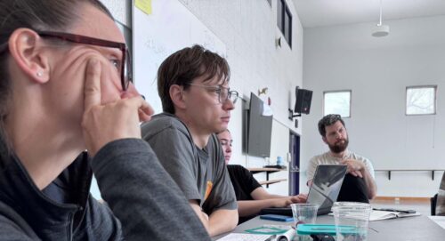 dancers listen attentively in class