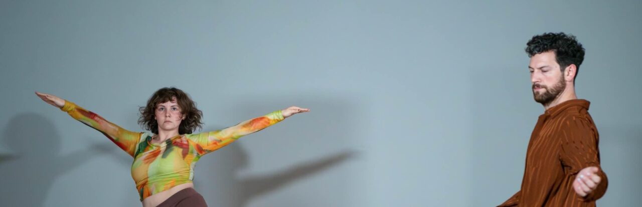 dancer with arms outstretched