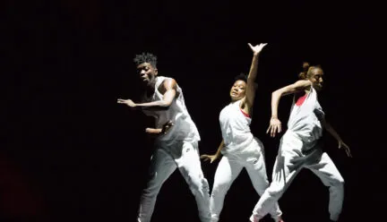 Three dancers in the spotlight