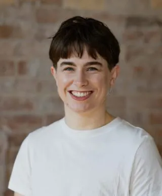 headshot of Gillian, wearing white shirt