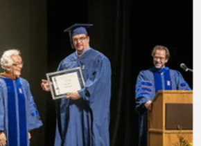 Shozo Sato and student with award