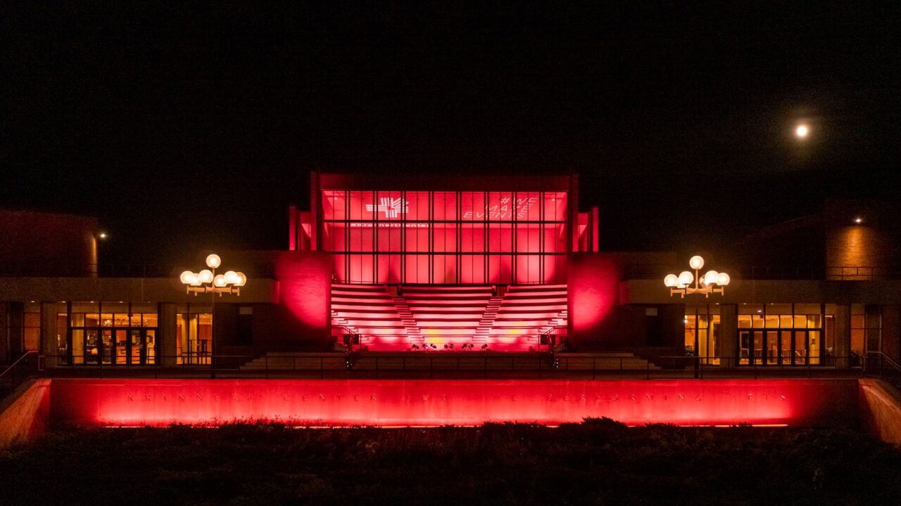Exterior of Krannert Center for the Performing Arts lit in red