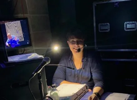 Stage manager working tech rehearsal from tech table.