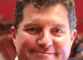 headshot of Jack Mehler smiling and looking at camera