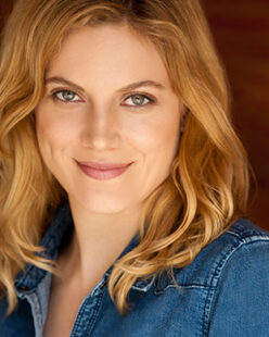 person smiling wearing jean jacket