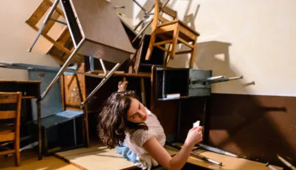 person seems to be floating with chairs around in all directions