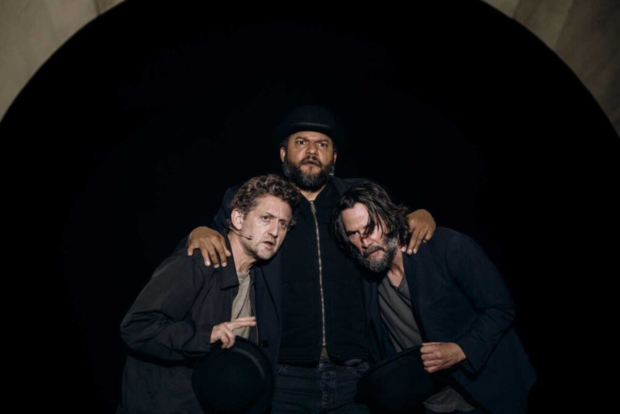 three people with arms around each other