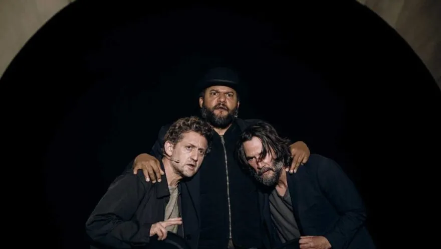 three people with arms around each other