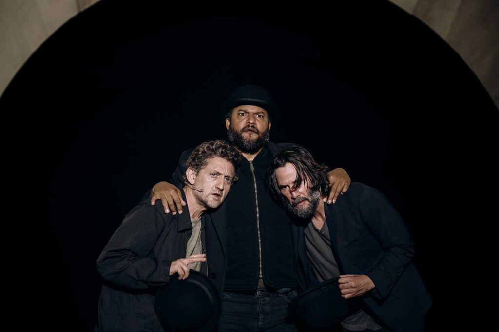 three people with arms around each other