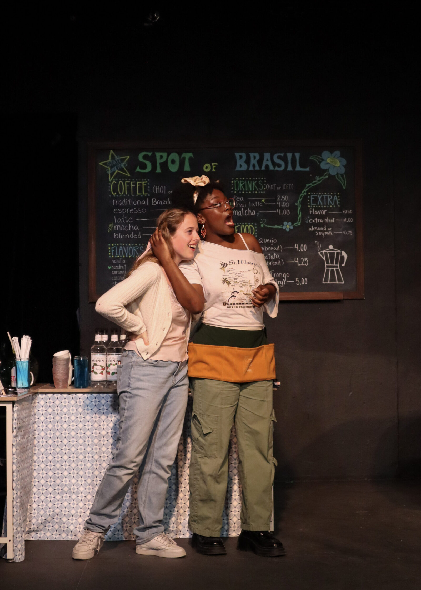 two people onstage in costume