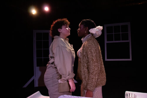 two people onstage face to face