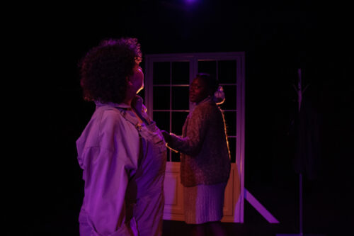 two people onstage looking at each other