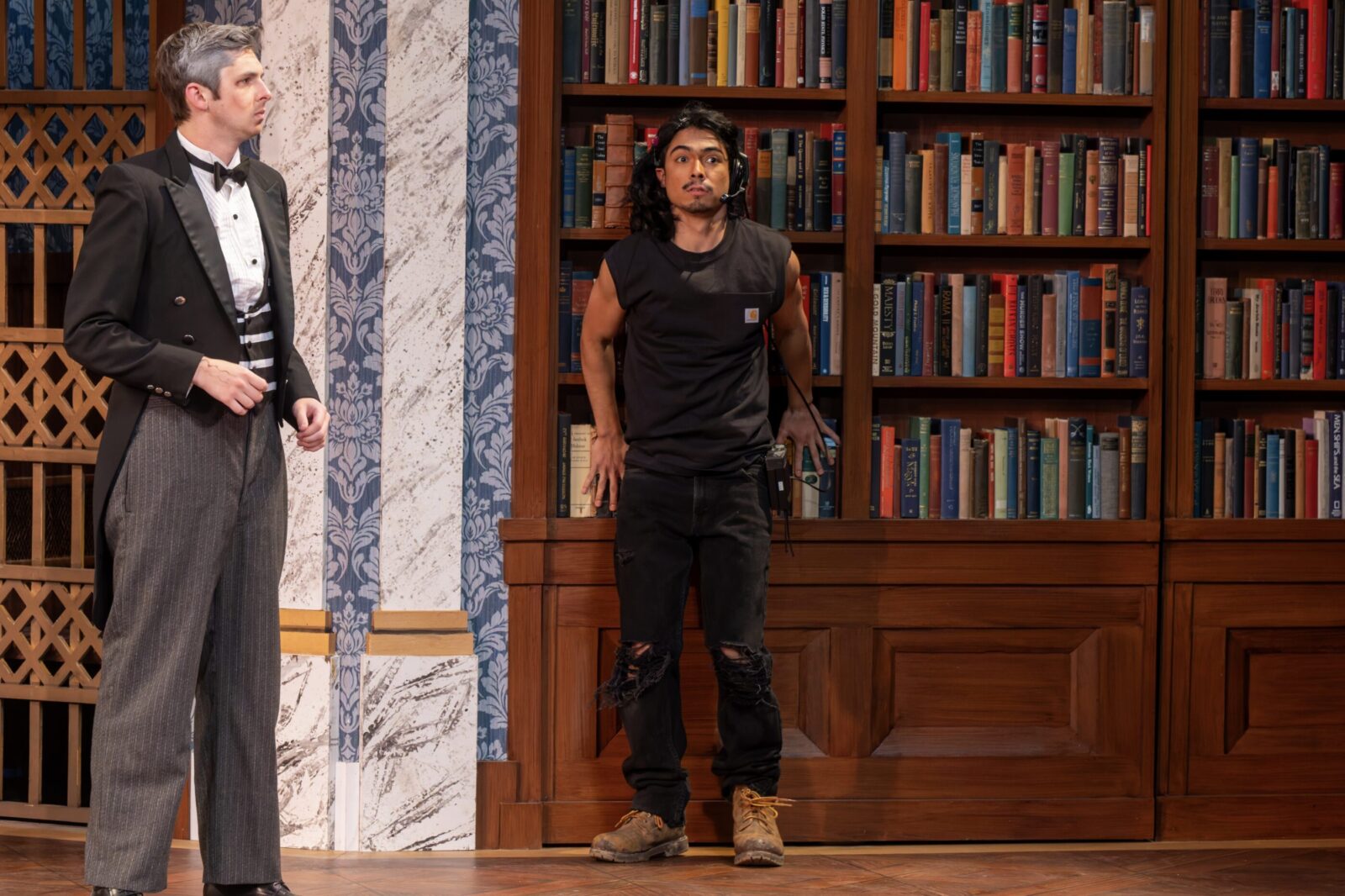 two people onstage in costume