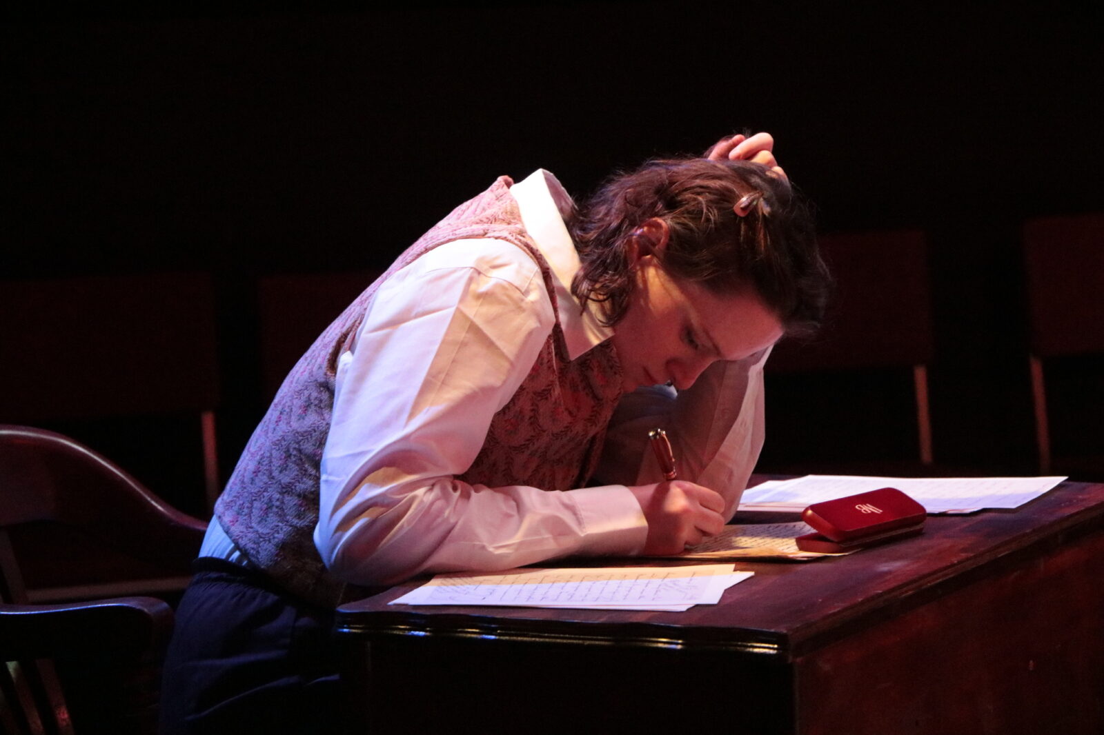 two people onstage looking at each other