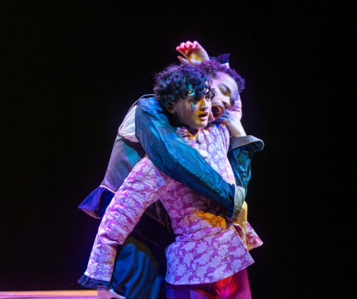 two people onstage holding each other
