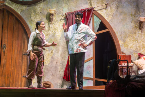 two people onstage talking with fake blood all over them