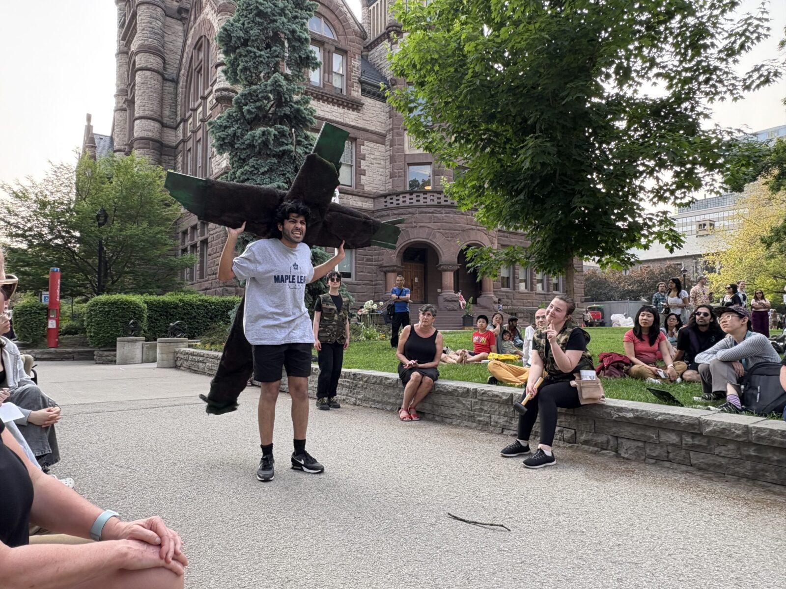 a person carries a cross on their back outdoors