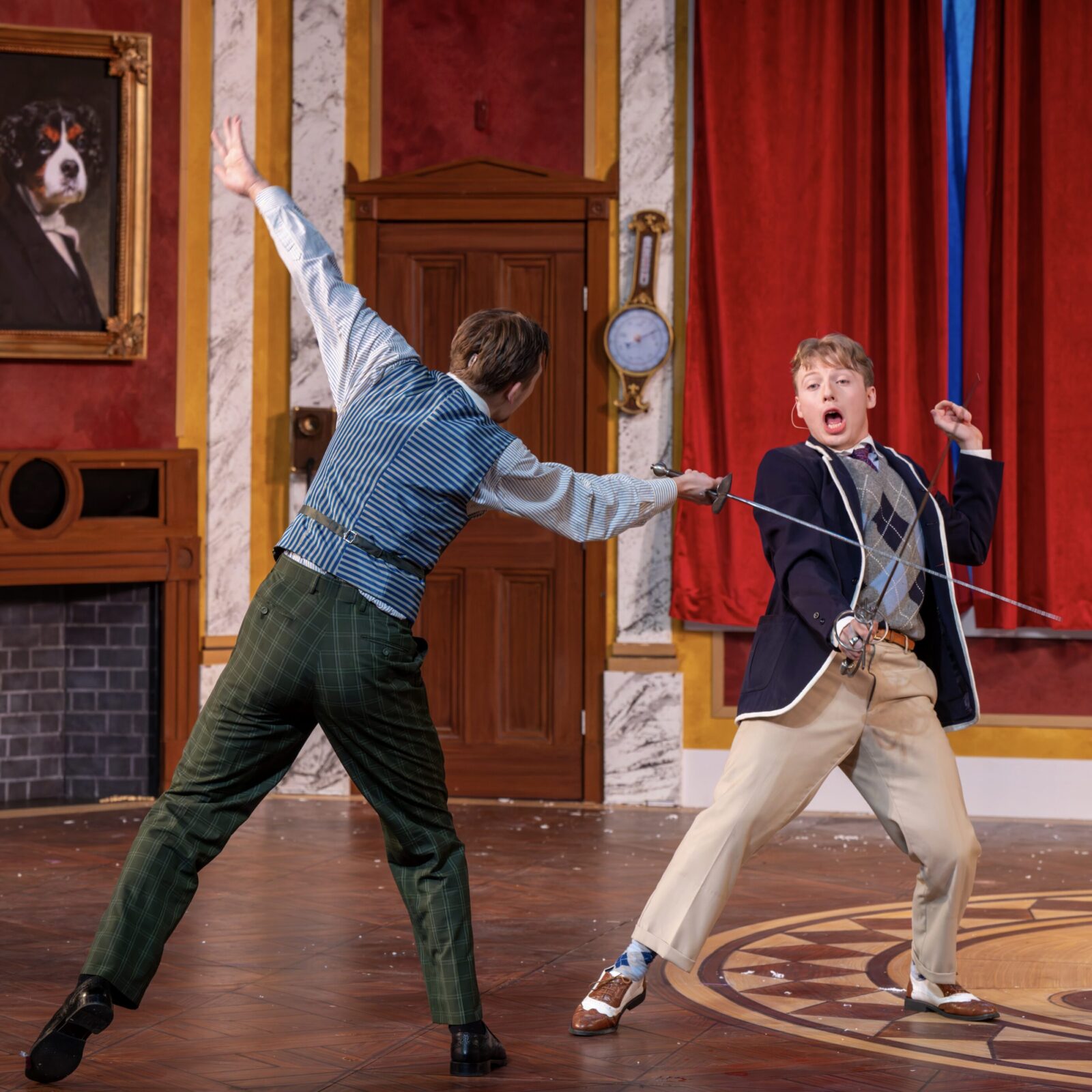 two people sword fighting onstage