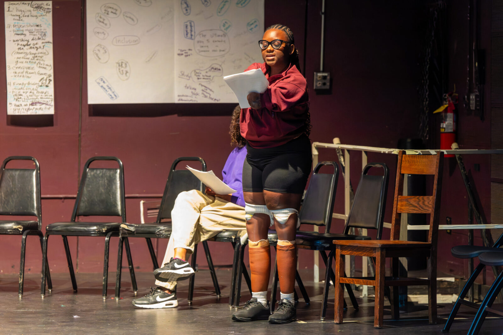 person standing and reading a script