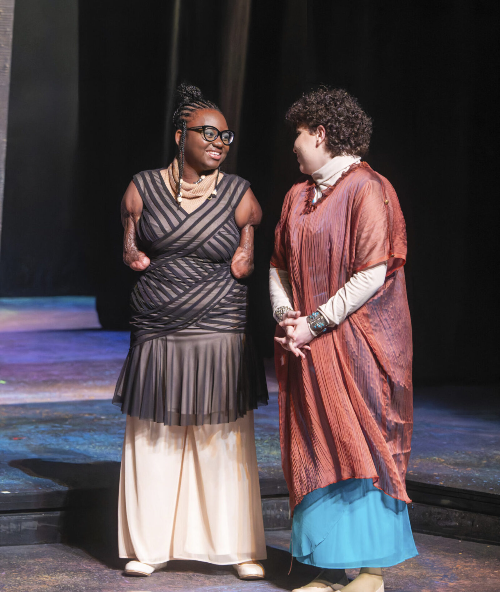 two people talking onstage