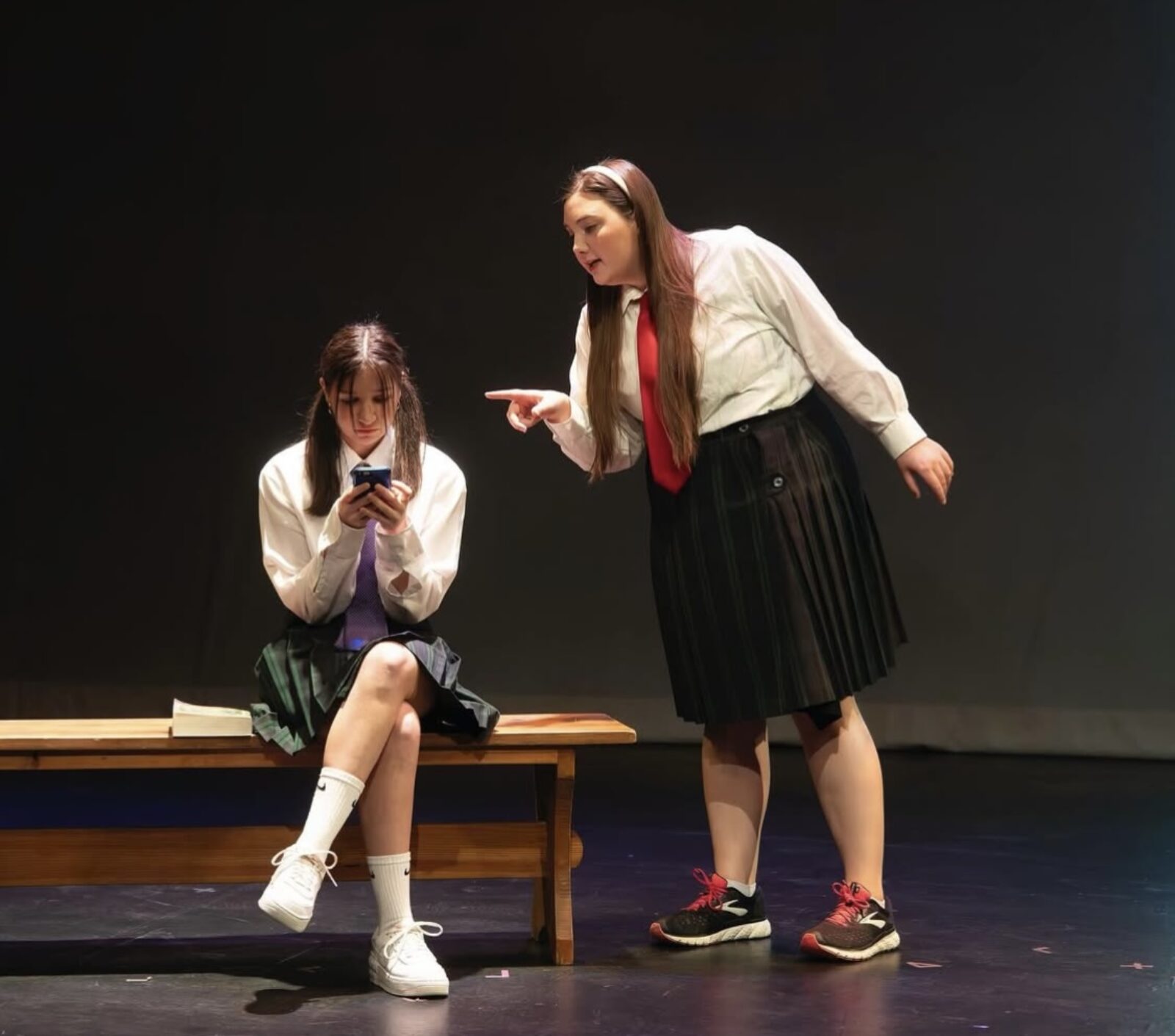 two people onstage in costume