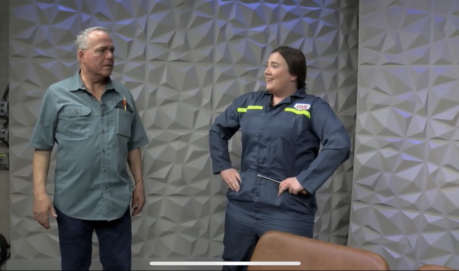 two people onstage in costume