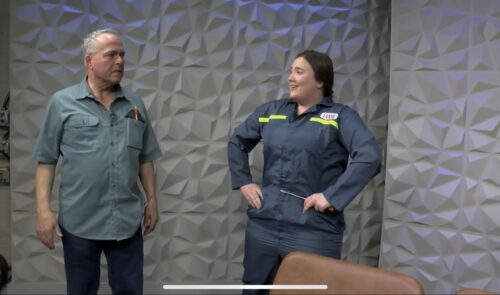 two people onstage in costume