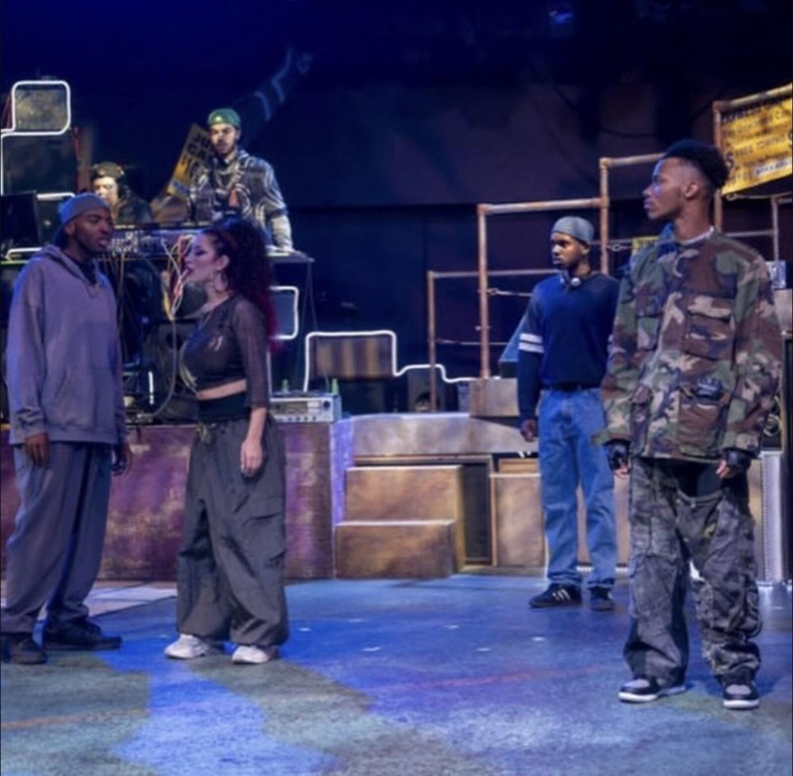 several people standing onstage 