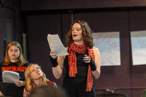 person reading from a script out loud