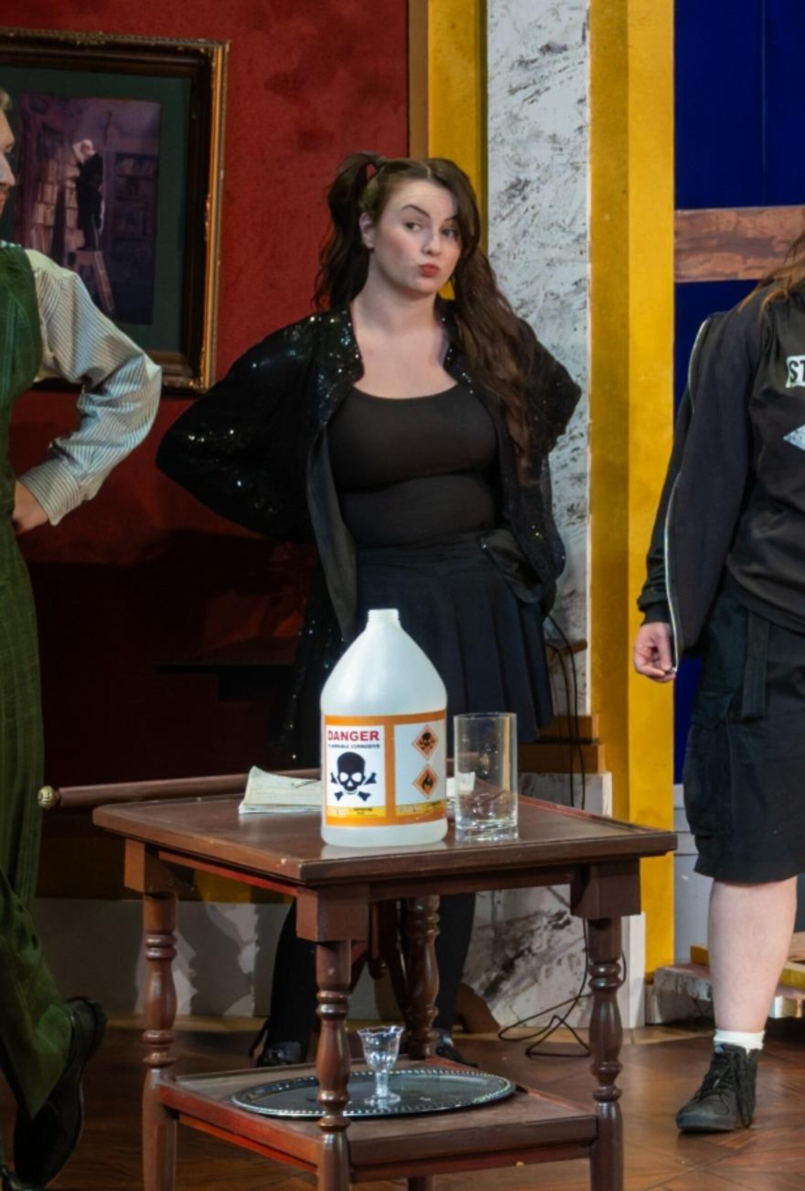 a person onstage wearing all black