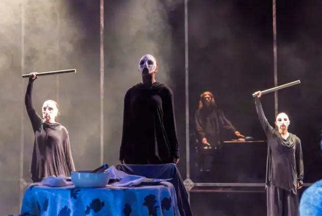Ensemble movers during a production of View From the Bridge at the Krannert Center's studio theatre