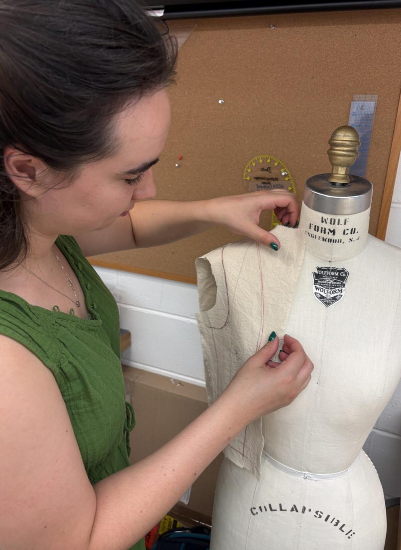 Costume staff conducting a fitting