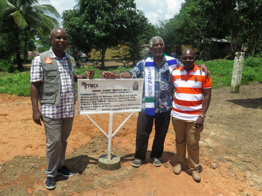 Sam Smith (center), along with Sierra Leone YMCA CEO and Freetown Rotarian Christian Kamara (left) and YMCA Eastern Area Director Frances Amadu (right), commemorate the establishment of a hand pump water well in the Koyagwema Community. Photo provided by Sam Smith.