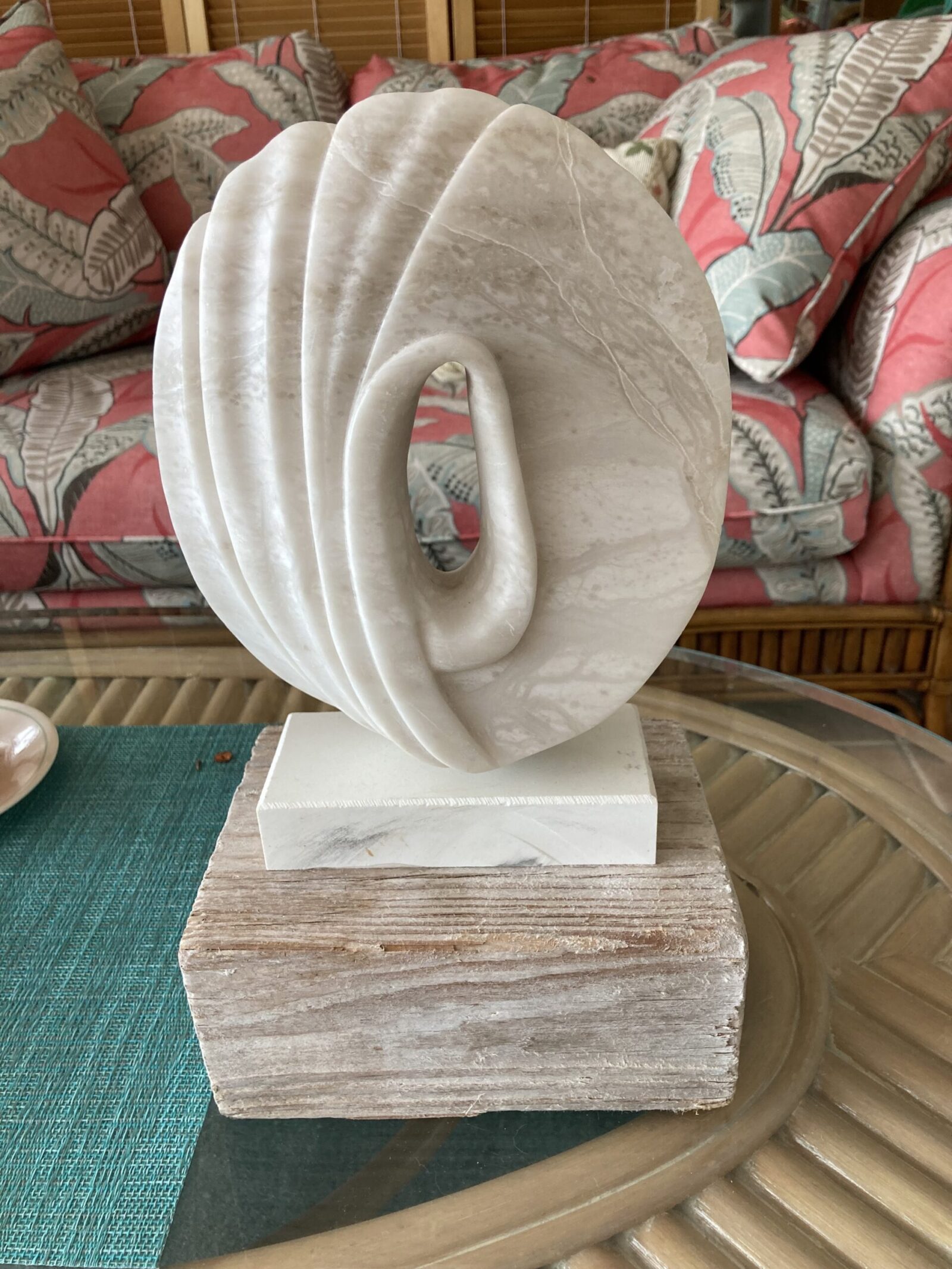 Stone sculpture on grey wood