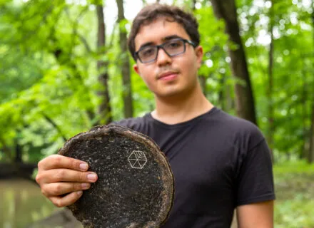 Gabe Tavas holding a piece of Pyrus™, the sustainable wood alternative.