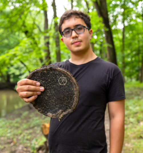 Gabe Tavas holding a piece of Pyrus™, the sustainable wood alternative.