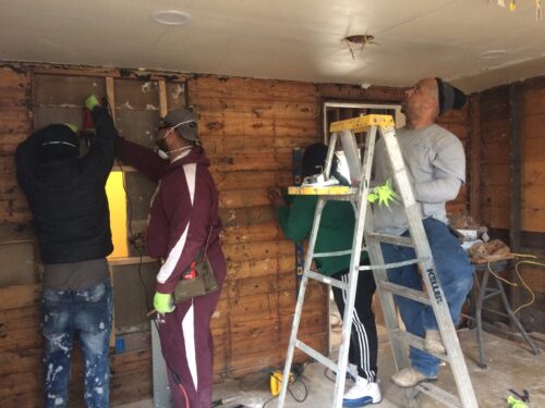 People working on remodels of a house