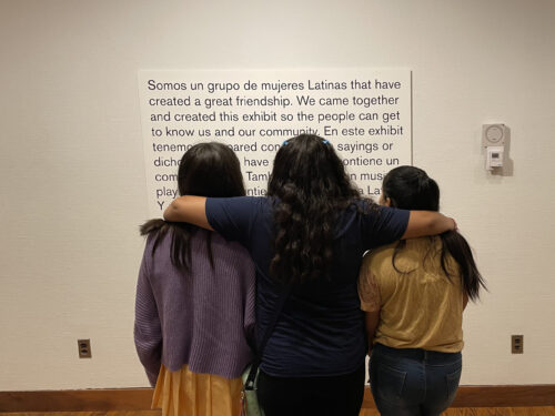 Three girls reflecting on the exhibit.