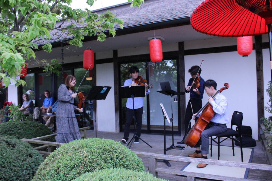 4-person ensemble playing instruments at Matsuri