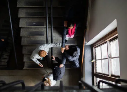 Papalia, faculty, and students from above on staircase