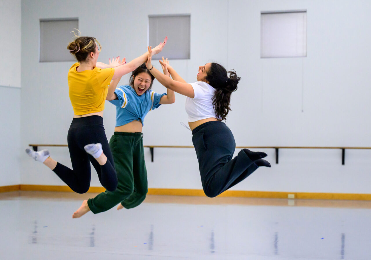 Choreographer, composer and dancer Nawal Assougdam, right, is joined by dancers Sophie Philbrick (BME Music Education ’26), left, and Yuno Kimura (BFA ’26), center.