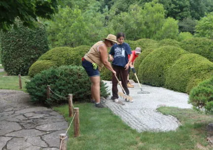 Susan working in garden with volunteers