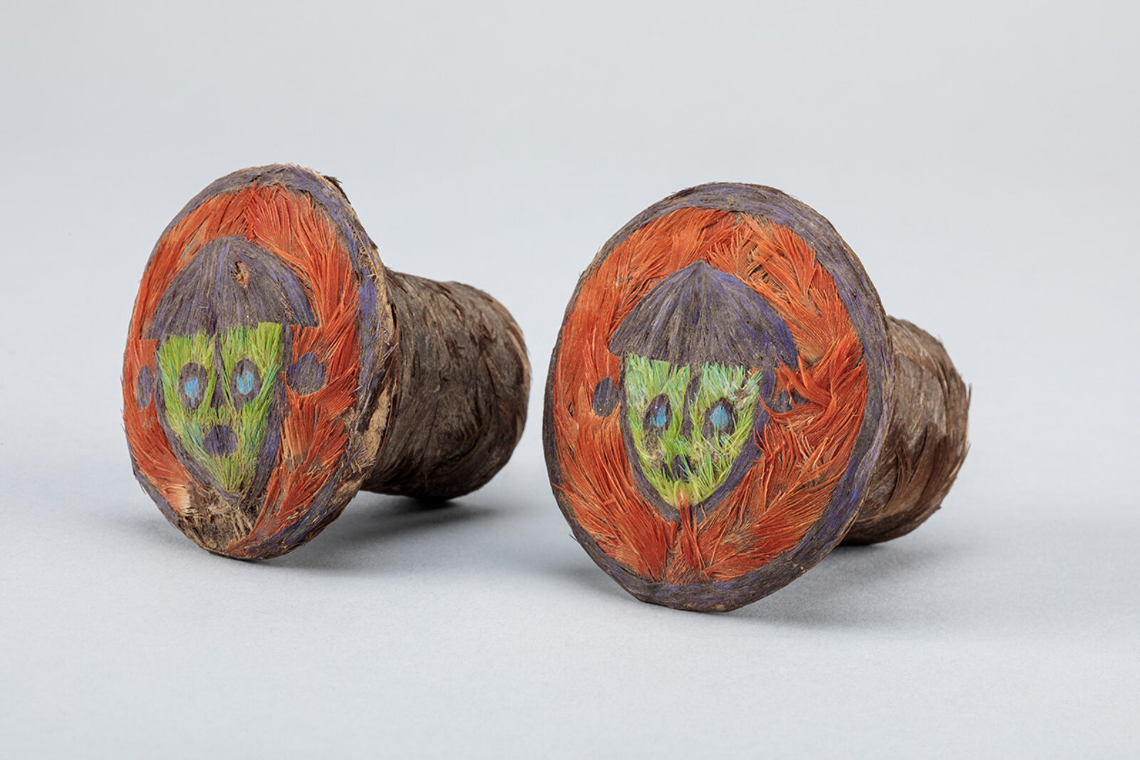 Feathered Ear Spools. Chancay or Inka, central coast, Peru, 1000-1470 CE, feathers, gourd, leather, 1 5/8 x 1 7/8 in. 1967-29-180