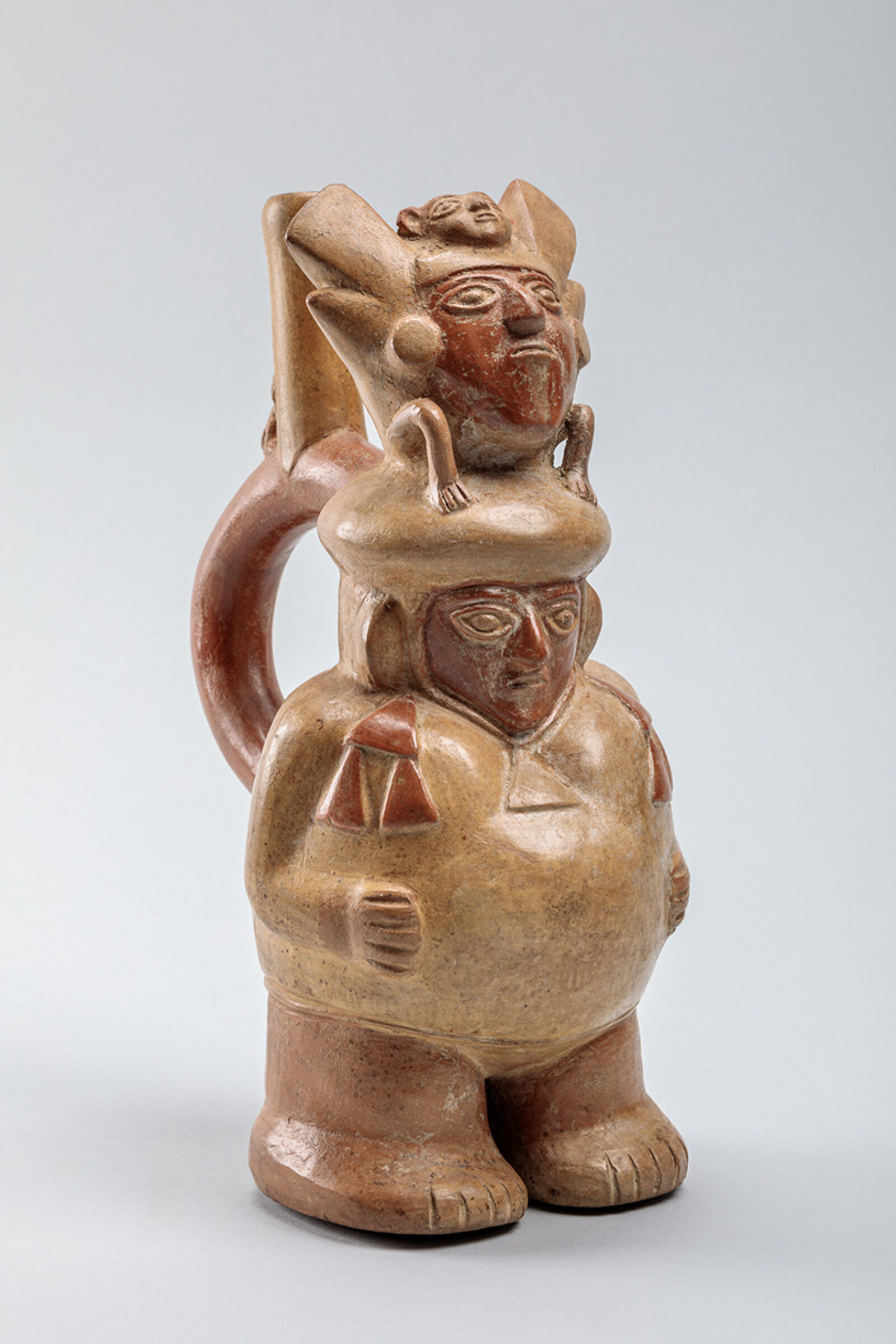 Figural Stirrup Vessel, Moche, 100-700 CE, North Coast, Peru, earthenware with slip. The Fred Olsen Collection. 1967-29-225