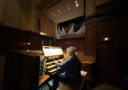 Linda Roaks (BME ‘ 70) playing the main organ in Smith Memorial Hall