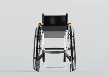 black and silver wheelchair with orange attachments