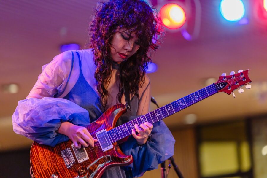 Woman playing guitar
