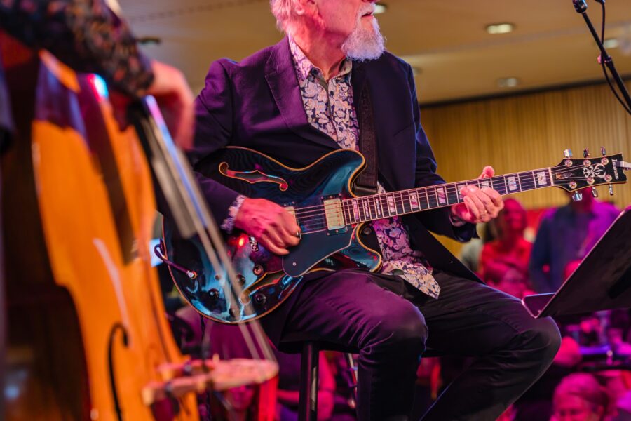 Close up of man playing guitar